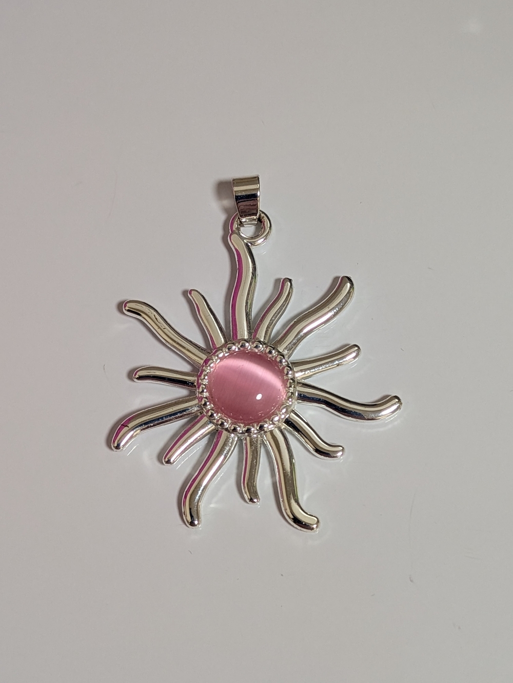 Silver Sunburst Pendant with Pink Cabochon